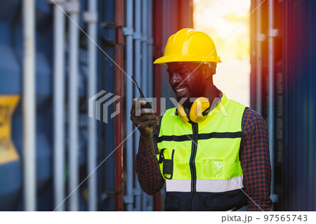customs shipping staff worker working at cargo port container ship yard with radio control 97565743