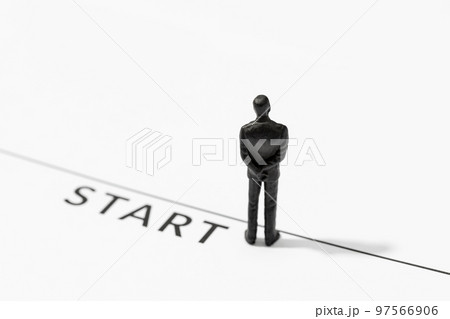 Businessman figurine on Starting line. Start, Concept of challenge or career path and change Businessman figurine on Starting line. Start, Concept of challenge or career path and change 97566906