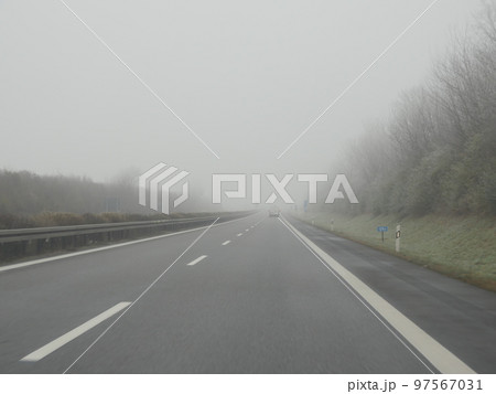 Highway in fog German Autobahn Highway in fog German Autobahn 97567031