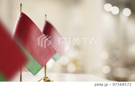 Small flags of the Belarus on an abstract blurry background 97568572