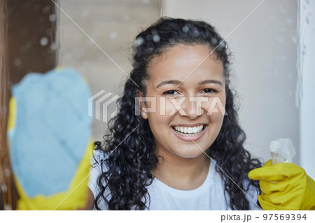 Cleaning, window and spray with portrait of woman with fabric rag for bacteria, hygiene and disinfection. Dust, germs and chemicals solution with girl cleaner and glass with product for housekeeping 97569394