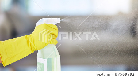 Cleaning, housekeeping and hands with detergent from spray bottle for disinfection, bacteria and household safety. Spring cleaning, housework and maid with gloves spray cleaning products in air 97569592