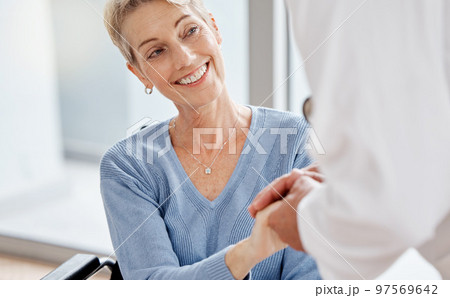 Senior woman, doctor or holding hands in wheelchair support, surgery trust or healthcare wellness security. Smile, happy or disability retirement elderly and medical worker in hospital life insurance 97569642