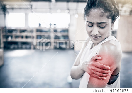Woman, fitness and shoulder pain in gym for exercise workout, training accident and sports medical emergency. Sad athlete, arm injury and physical therapy, arthritis or muscle wellness in health club 97569673