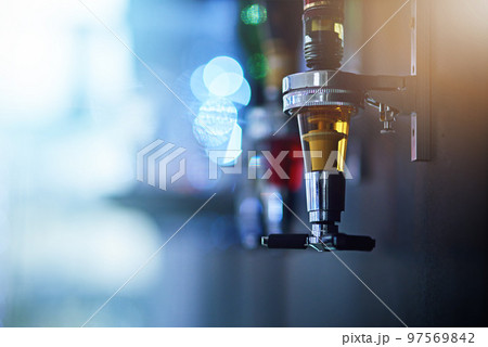 Alcohol, drink and closeup of tap in nightclub for cocktail shots, pour alcoholic beverage and beer. Bartending, liquor and focus on beer tap for clubbing, restaurant and cocktail bar in background Alcohol, drink and closeup of tap in nightclub for cocktail shots, pour alcoholic beverage and beer. Bartending, liquor and focus on beer tap for clubbing, restaurant and cocktail bar in background 97569842