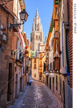 Toledo, Spain alleyway towards Toledo Cathedral 97570350