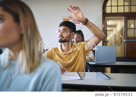 University student, hands and answer question in classroom for teaching, school education or learning. Young man, college student and raised hand for asking questions while studying in campus lecture 97570531