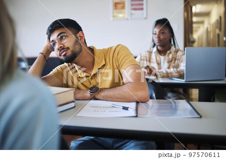 Classroom, learning and students listening to lecture, workshop or course education for study, scholarship and college knowledge. Indian, diversity and university student thinking, focus and fatigue 97570611