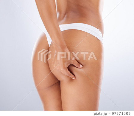 Women's beautiful ass in designer underwear. Hands - Stock Photo [64425913]  - PIXTA