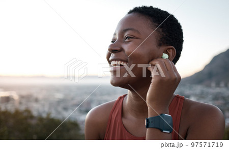Black woman, laughing face or fitness earphones in sunset workout, healthcare training or cardiovascular exercise in sunrise wellness. Zoom, happy smile or sports runner listening to motivation music Black woman, laughing face or fitness earphones in sunset workout, healthcare training or cardiovascular exercise in sunrise wellness. Zoom, happy smile or sports runner listening to motivation music 97571719