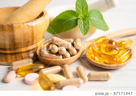 Alternative medicine herbal organic capsule with vitamin E omega 3 fish oil, mineral, drug with herbs leaf natural supplements for healthy good life. 97571947