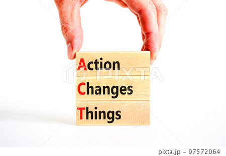 ACT action changes things symbol. Concept words ACT action changes things on wooden blocks on a beautiful white table white background. Business and ACT action changes things concept. Copy space. 97572064
