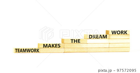 Teamwork makes the dream work symbol. Concept words Teamwork makes the dream work on wooden blocks on a beautiful white table white background. Business Teamwork makes dream work concept. Copy space. 97572095