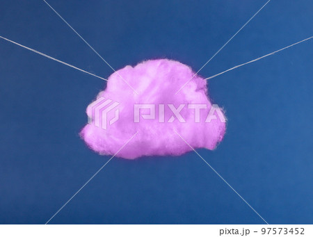 Purple cloud on strings on blue sky background. Imagination, fantasy, dreaming concept in surreal style. Purple cloud on strings on blue sky background. Imagination, fantasy, dreaming concept in surreal style. 97573452