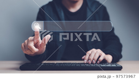 Man finger showing a search bar virtual and hand on computer keyboard to Searching for information. Using Search Console with website. Data Search Technology Search Engine Optimization concept. 97573967