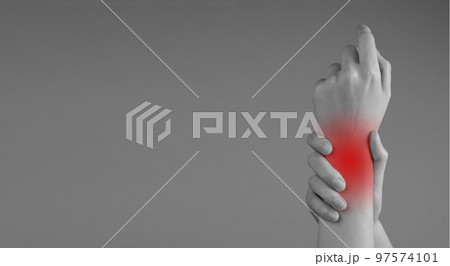 Banner with wrist pain. Woman holding painful hand with red point closeup. Sprain, fracture. Arthritis, chronic diseases. Health care, orthopedic problems and medicine concept. Copy space 97574101