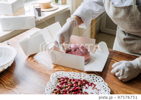 Valentines Day Marketing Ideas for Small Businesses. Confectioner chef make heart shape pink Mirror Glaze mousse cake 97576751