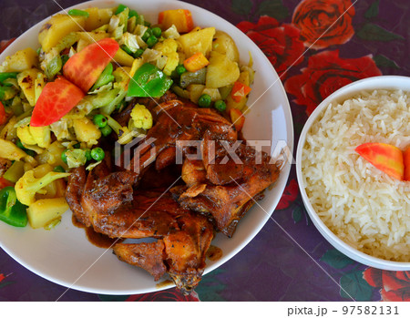 Drilled chicken with vegetable and rice Drilled chicken with vegetable and rice 97582131