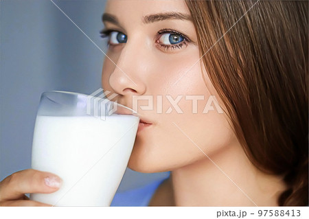 Happy young woman drinking milk or protein cocktail from glass, healthy drink, diet and wellness concept 97588413