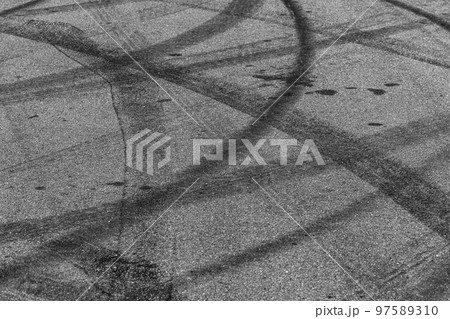 Tire tracks texture and background, Asphalt texture with line and tire marks, Automobile automotive tire skid mark on race track, Abstract texture car drift tire skid mark. 97589310
