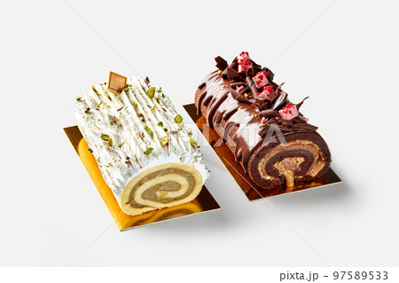 Two Swiss cake rolls of vanilla and chocolate biscuit Two Swiss cake rolls of vanilla and chocolate biscuit 97589533