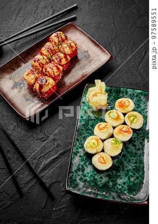 Baked uramaki with salmon and makizushi with cheese hat for two Baked uramaki with salmon and makizushi with cheese hat for two 97589551