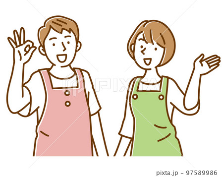 笑顔で案内するエプロン姿の若い2人の男女セット 笑顔で案内するエプロン姿の若い2人の男女セット 97589986