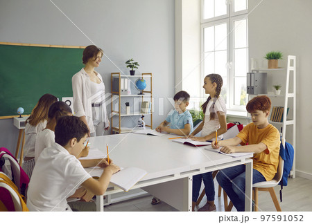 Elementary school students do their homework together in extended day group class. Elementary school students do their homework together in extended day group class. 97591052