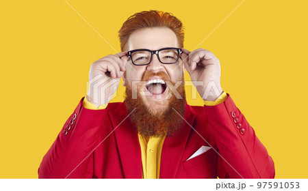Funny eccentric bearded fat man wearing eyeglasses laughing out loud on orange background. Funny eccentric bearded fat man wearing eyeglasses laughing out loud on orange background. 97591053