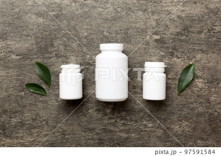 supplement pills with medicine bottle health care and medical top view. Vitamin tablets. Top view mockup bottle for pills and vitamins with green leaves, natural organic bio supplement, copy space supplement pills with medicine bottle health care and medical top view. Vitamin tablets. Top view mockup bottle for pills and vitamins with green leaves, natural organic bio supplement, copy space 97591584