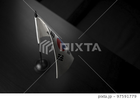 Small national flag of the South Korean on a black background Small national flag of the South Korean on a black background 97591779