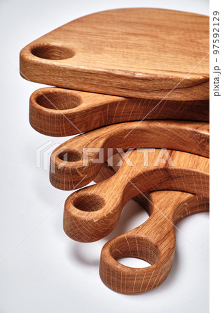 different kind of handmade oak chopping board on white background different kind of handmade oak chopping board on white background 97592129