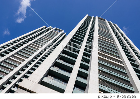 Low angle of apartment building over blue sky Low angle of apartment building over blue sky 97593568