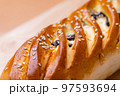 Raisin bread over the wooden board 97593694