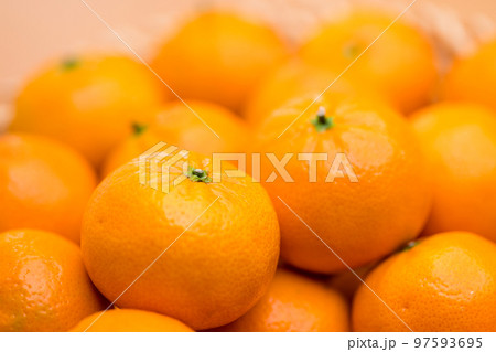 Stack of citrus fruit on basket Stack of citrus fruit on basket 97593695
