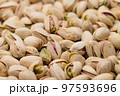 Stack of pistachio nut snack 97593696