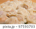 Boiled chinese meat dumpling on plate 97593703