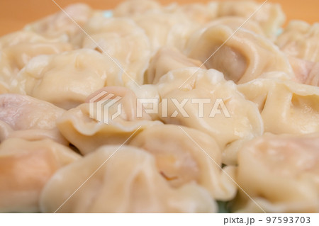Boiled chinese meat dumpling on plate Boiled chinese meat dumpling on plate 97593703