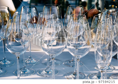 A set of glasses for wine before serving on the festive table 97594215