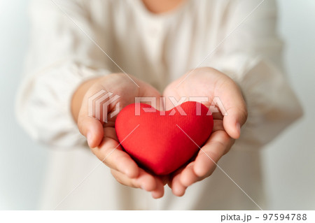 Woman holding red heart, love, health insurance, donation, happy charity volunteer, world mental health day, world heart day, valentine's day Woman holding red heart, love, health insurance, donation, happy charity volunteer, world mental health day, world heart day, valentine's day 97594788
