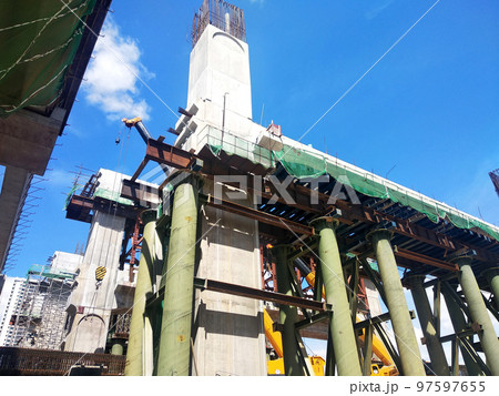 SELANGOR, MALAYSIA -JULY 6, 2022: An elevated road is under construction. Reinforced concrete is used for the structure. Construction is done in stages according to the sequence of works. SELANGOR, MALAYSIA -JULY 6, 2022: An elevated road is under construction. Reinforced concrete is used for the structure. Construction is done in stages according to the sequence of works. 97597655