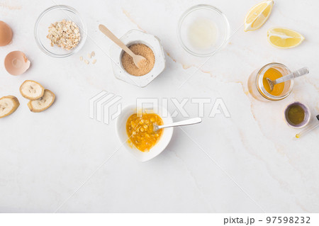 Flatlay with homemade beauty products: fresh ingredients like oat, honey, lemon, banana, egg, olive Flatlay with homemade beauty products: fresh ingredients like oat, honey, lemon, banana, egg, olive 97598232