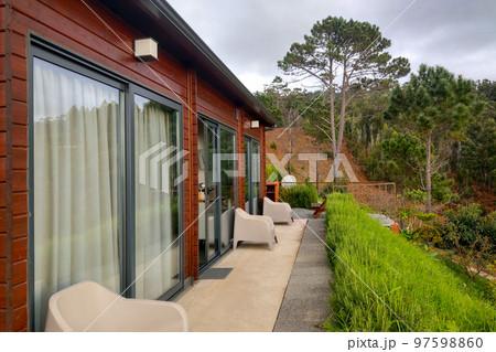 A beautiful modern house with a picturesque view of nature in the forest. 97598860