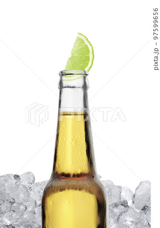 Mexican beer bottle with lime slice and frost on white background Mexican beer bottle with lime slice and frost on white background 97599656