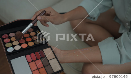 Beauty concept of 4k Resolution. Closeup makeup multicolored eyeshadow palette with brush in a beauty salon. 97600146