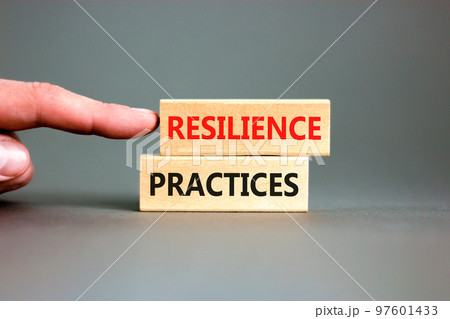 Resilience practices symbol. Concept word Resilience practices typed wooden blocks. Beautiful grey table grey background. Businessman hand. Business and resilience practices concept. Copy space. 97601433