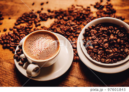 Illustrative image of a cup of hot espresso and coffee beans Illustrative image of a cup of hot espresso and coffee beans 97601843