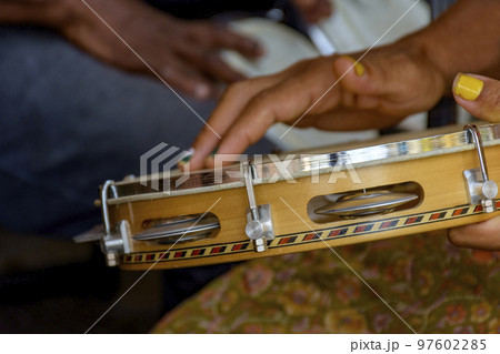 Percussionist playing tambourine during brazilian carnival 97602285