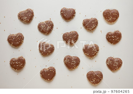 chocolate hearts cookies pattern with sweet nuts. Valentines day dessert overhead shot 97604265