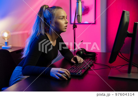 Happy and Beautiful Blonde Gamer Girl Playing Online Video Game on Her  Personal Computer Stock Photo by kjekol